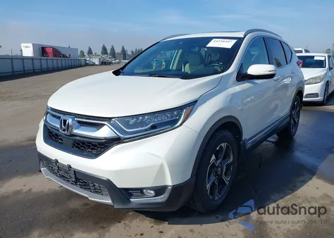 2017 Honda Cr-V Touring z USA, uszkodzony, nr VIN 2HKRW1H9XHH515567